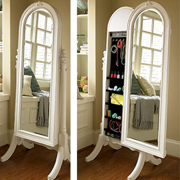 Mirror moves to the side to reveal more hidden compartments.
